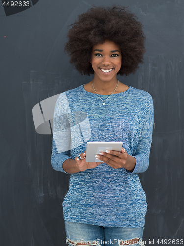 Image of Happy African American Woman Using Digital Tablet