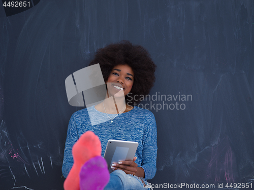 Image of Happy African American Woman Using Digital Tablet