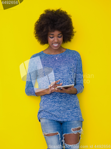 Image of young black Woman Using Digital Tablet