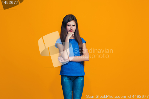 Image of Young serious thoughtful teen girl. Doubt concept.