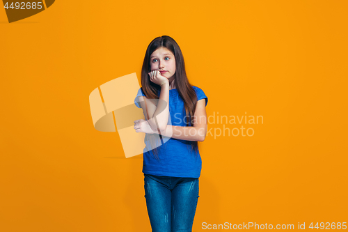 Image of Young serious thoughtful teen girl. Doubt concept.