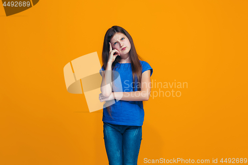 Image of Young serious thoughtful teen girl. Doubt concept.