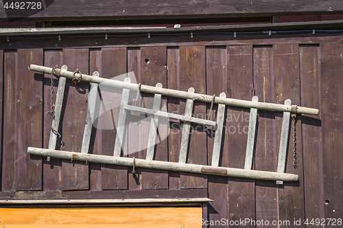 Image of Wooden ladder hanging on the wall