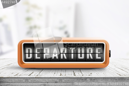 Image of Departure sign in a retro alarm clock