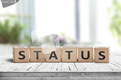 Image of Status sign made of wood on a table