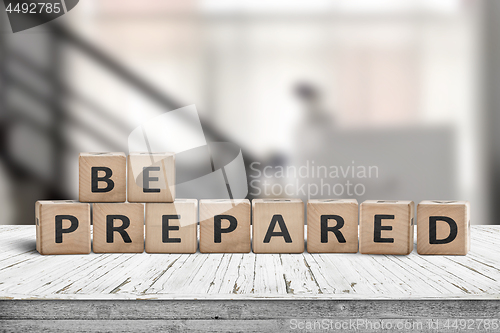 Image of Be prepared phrase on wooden dices in a bright room