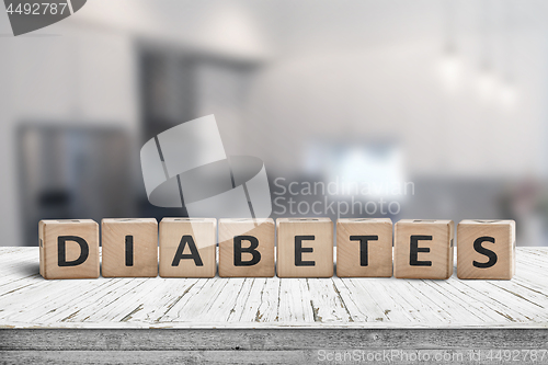 Image of Diabetes disease sign on a table in a bright kitchen