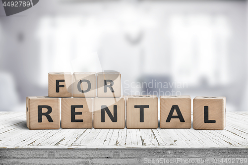 Image of Sign with the text for rent on a desk