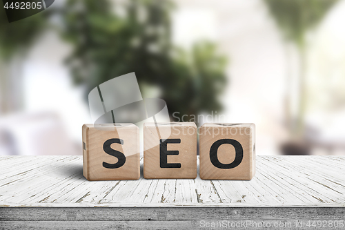 Image of SEO word sign on a table in a bright room