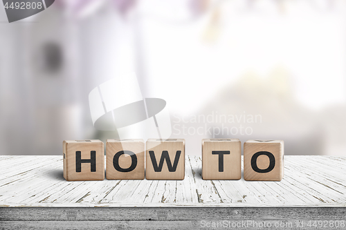 Image of How to sign in a room on a wooden table