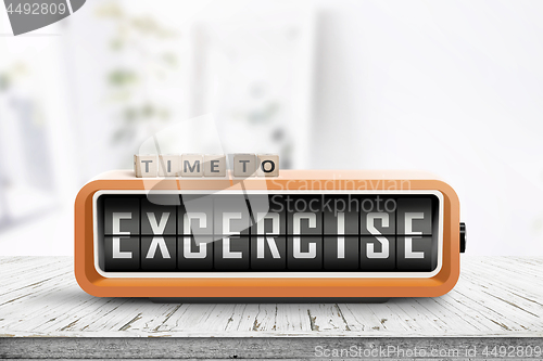 Image of Time to excercise message on an alarm clock