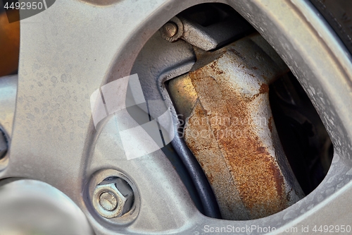 Image of Wheel closeup with rusty brakediscs