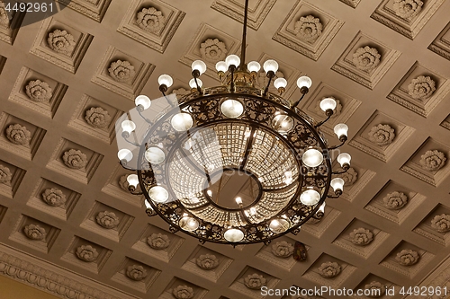 Image of Chandelier on decoarted ceiling