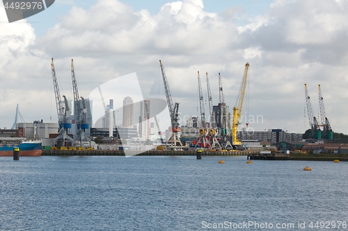 Image of Industrial ships in dock with rotterdam city view