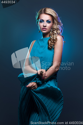 Image of Beautiful girl in blue dress