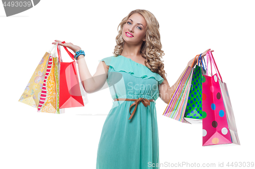 Image of Beautiful girl with shopping bags