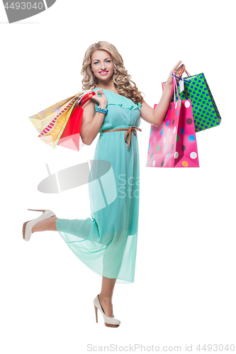 Image of Beautiful girl with shopping bags