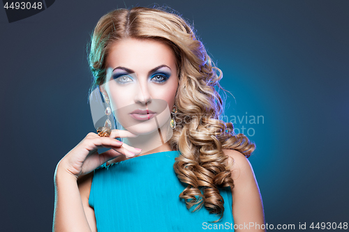 Image of Beautiful girl in blue dress