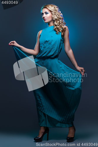 Image of Beautiful girl in blue dress