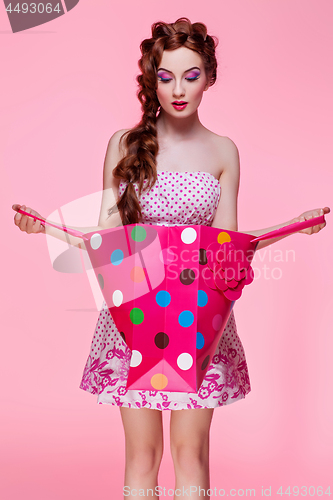 Image of Beautiful girl with shopping bag