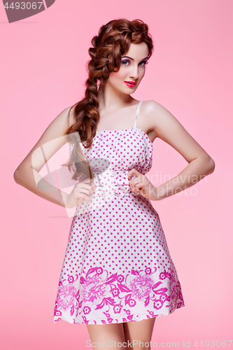 Image of Beautiful girl in dress with braided hair