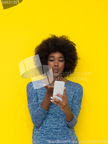 Image of young black Woman Using mobile phone