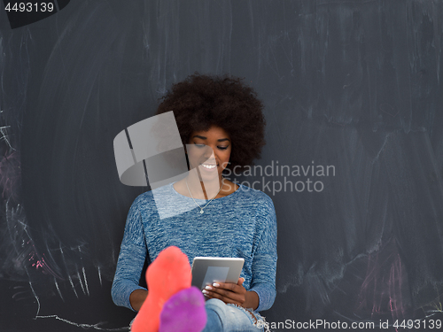 Image of Happy African American Woman Using Digital Tablet