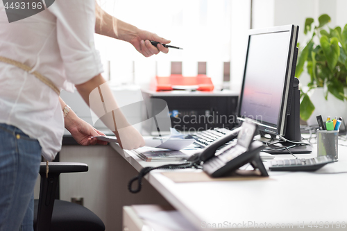 Image of designers in office at the wooden furniture manufacture