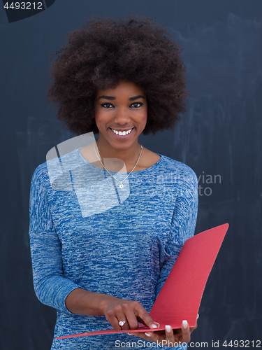 Image of African American woman with red folder