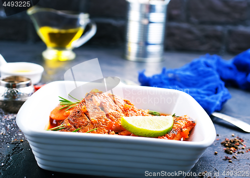 Image of fish with tomato sauce 