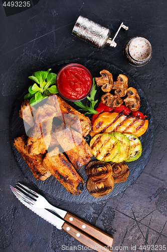 Image of grilled vegetables and ribs