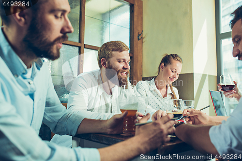 Image of Team job while relaxing in pub.