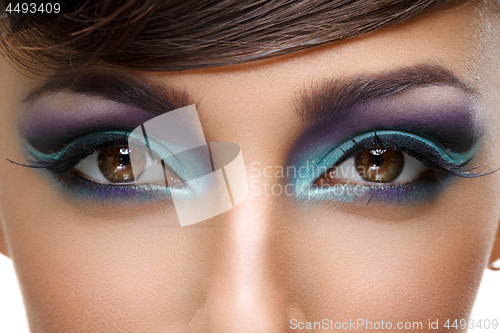 Image of Beautiful girl with bright vivid purple make-up 