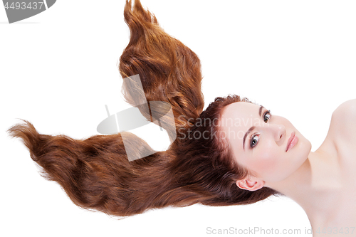 Image of Beautiful girl with long red hair