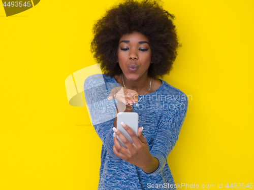 Image of young black Woman Using mobile phone