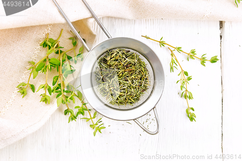 Image of Thyme dry in strainer on board top