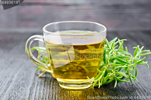 Image of Tea of rosemary in cup on dark board