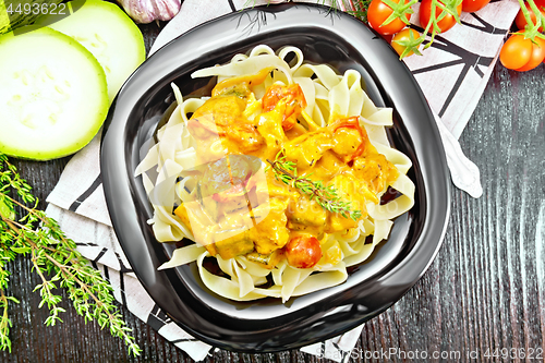 Image of Pasta with goulash in plate on board top