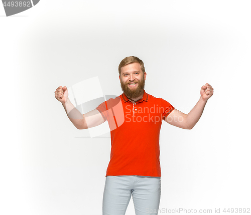 Image of Closeup of young man\'s body in empty red t-shirt isolated on white background. Mock up for disign concept