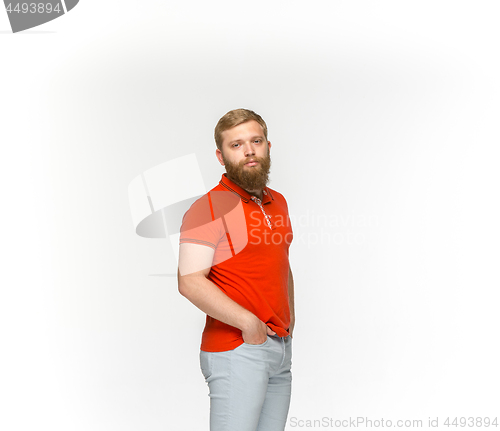 Image of Closeup of young man\'s body in empty red t-shirt isolated on white background. Mock up for disign concept