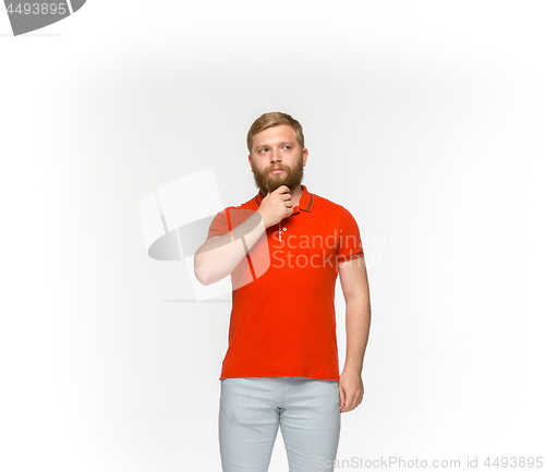 Image of Closeup of young man\'s body in empty red t-shirt isolated on white background. Mock up for disign concept