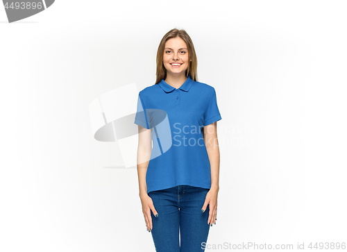 Image of Closeup of young woman\'s body in empty blue t-shirt isolated on white background. Mock up for disign concept