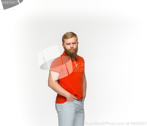 Image of Closeup of young man\'s body in empty red t-shirt isolated on white background. Mock up for disign concept