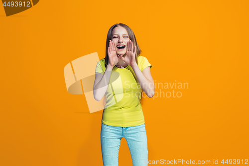 Image of Isolated on pink young casual teen girl shouting at studio