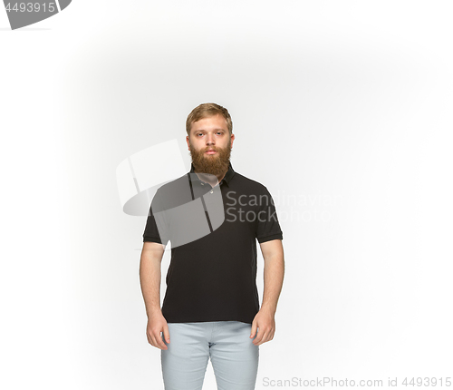 Image of Closeup of young man\'s body in empty black t-shirt isolated on white background. Mock up for disign concept