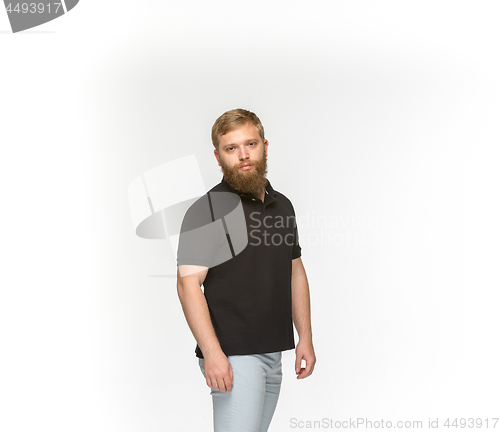 Image of Closeup of young man\'s body in empty black t-shirt isolated on white background. Mock up for disign concept