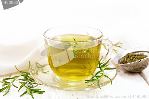 Image of Tea of rosemary in cup with napkin on board