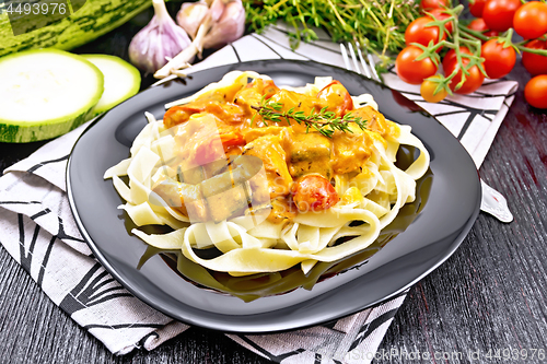 Image of Pasta with goulash in plate on towel