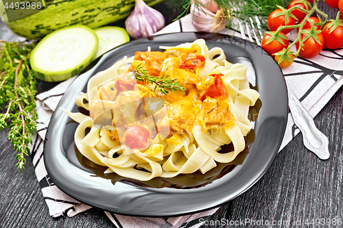 Image of Pasta with goulash in plate on board