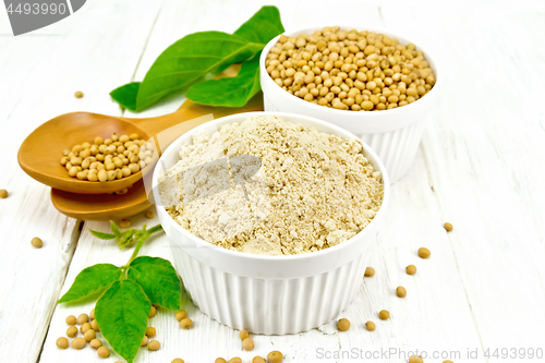 Image of Flour soy with soybeans and leaf on light wooden board